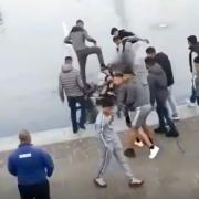 Violent video shows gang kicking a boy in the head in Centenary Square