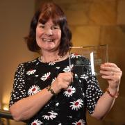 Sue Roberts from Haworth primary with her award.