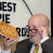 The late James Wilson inspecting a pie in his capacity as head judge of the World Pie Championship, Barnoldswick in 2019