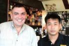 Kevin Quill, pictured with a Thai friend, is hoping to return to the UK to be fitted with an artificial voice box