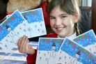 Rosie Hodge with some of the Christmas cards which she designed