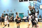 Bradford Dragons' Chris McGrew lays up on the way to a basket against Newham Neptunes