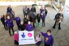 Founder and manager of Haworth RDA Jackie Butterfield (front right) joins staff, volunteers and users to celebrate the Big Lottery Fund grant of £406,751