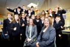 SUCCESS: Whitcliffe Mount head teacher Jennifer Templar (front) and teacher Emma Taylor with delighted pupils
