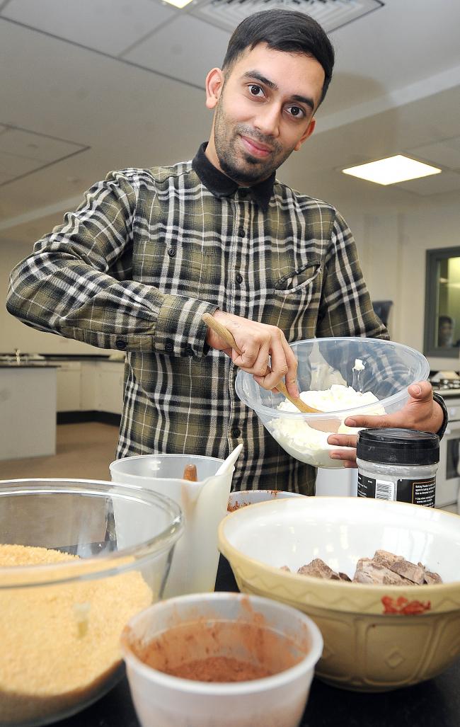 Former Great British Bake Off               contestant, Ali Imdad, at Dixons Allerton Academy, as he hopes to            encourage more        students,              especially young Asian males, to take up the     subject