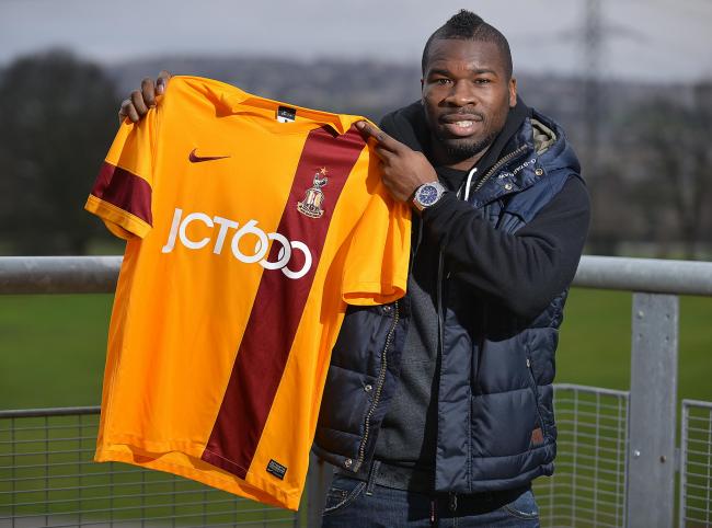 Aaron Mclean poses with a City shirt on his first day training with his new club