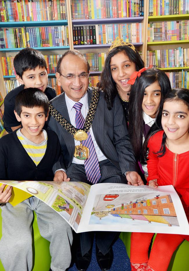 Lord Mayor of Bradford Councillor Khadim Hussain opens the library at Horton Grange Primary School Bradford with pupils (from left), Huzalfa Bismillah, nine, Subhan Ibrar, Amila Kauser, Muskaan Bhatti, and Maryam Alam (all ten)