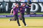 Adam Lyth, right, and Aaron Finch celebrate a spectacular team catch to take the wicket of Leicestershire's Josh Cobb