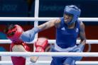 Nicola Adams knocks down Canacan Ren of China on her way to winning Olympic gold
