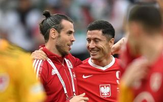 Wales star Gareth Bale shares a laugh with Robert Lewandowski after the UEFA Nations League match in Poland on Wednesday
