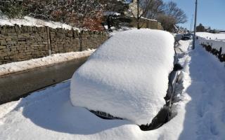 A snow-covered car near Keelham