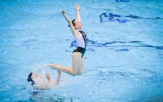 Lily Priestley jumps into action for the team at  Bradford Artistic Swimming in a competition last year