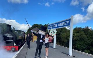 Mr Monopoly and day tripper Heather Griffin at Bolton Abbey Station
