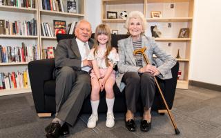 Arek Hersh MBE and his wife Jean Hersh, pictured with one of the children Arek spoke to during a school visit