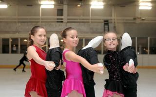 Freya Harkan, Gracie-Mae Scott and Poppy-Rose Scott with ‘partners’ at Bradford Ice Arena in 2011