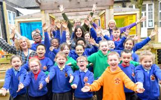 The children at St Columba's Catholic Primary School celebrating the new Ofsted rating