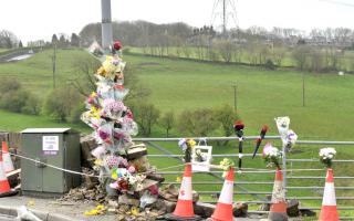 At least two dozen floral tributes were at the scene of a fatal crash near Clayton village.