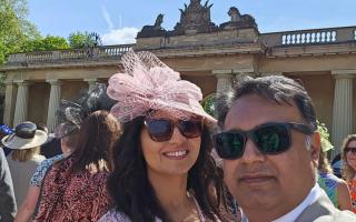 Reverend Nathan Javed e and his wife Urpha in the grounds of Buckingham Palace