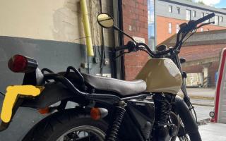 Police found this black and tan Sinnis motorbike in bushes in a Bramley ginnel