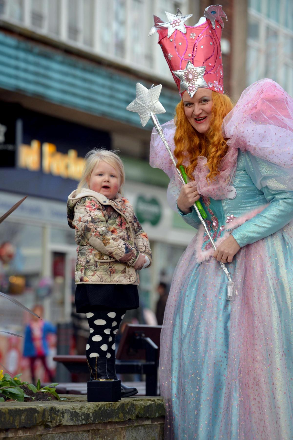 Bryann Capstick, three, with Glinda, the Good Witch of the North