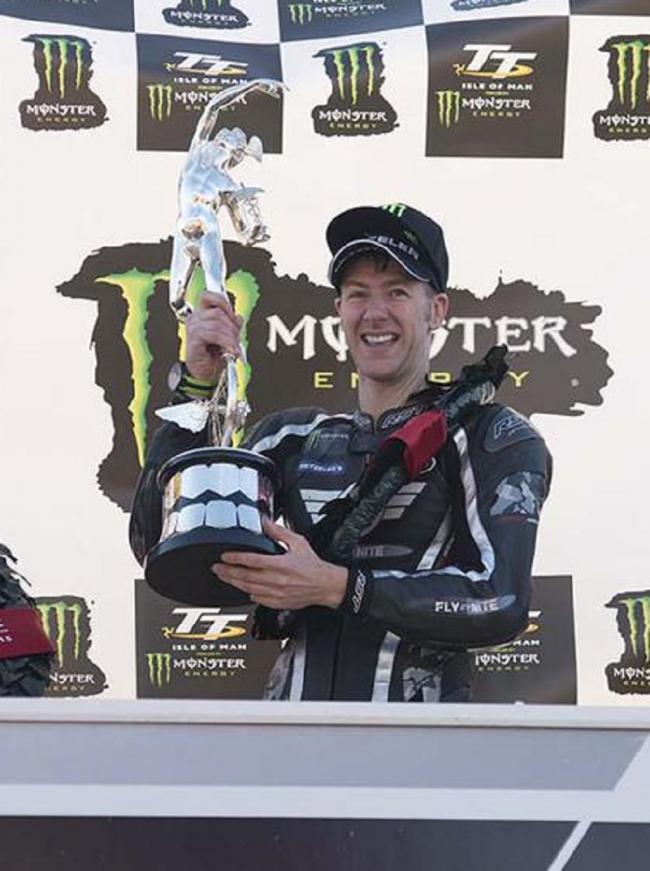 Ian Hutchinson lifts the Supersport trophy at his first TT meeting since 2010