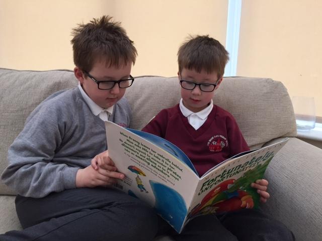 Casper (aged 9) and Alex (aged 7) Moorhouse reading together. "I went to the library last week and borrowed a book called Fortunately, Unfortunately. I read it to my big brother and we laughed at the pirate captain, who was not very good at sword fighting