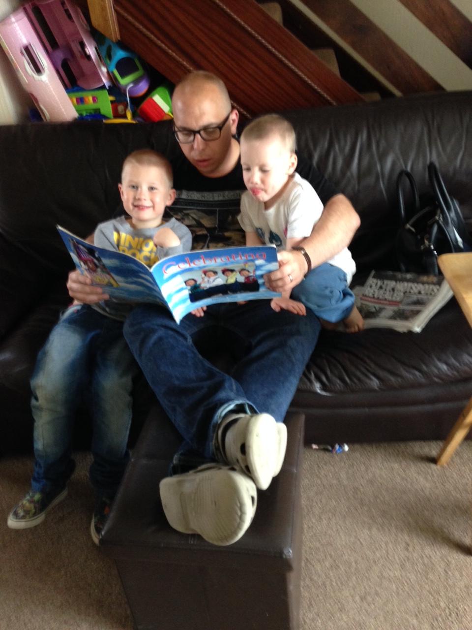 David Clough reading to his sons Dylan, aged 6, and Noah, aged 4. Their favourite book is The Gruffulo by Julia Donaldson.