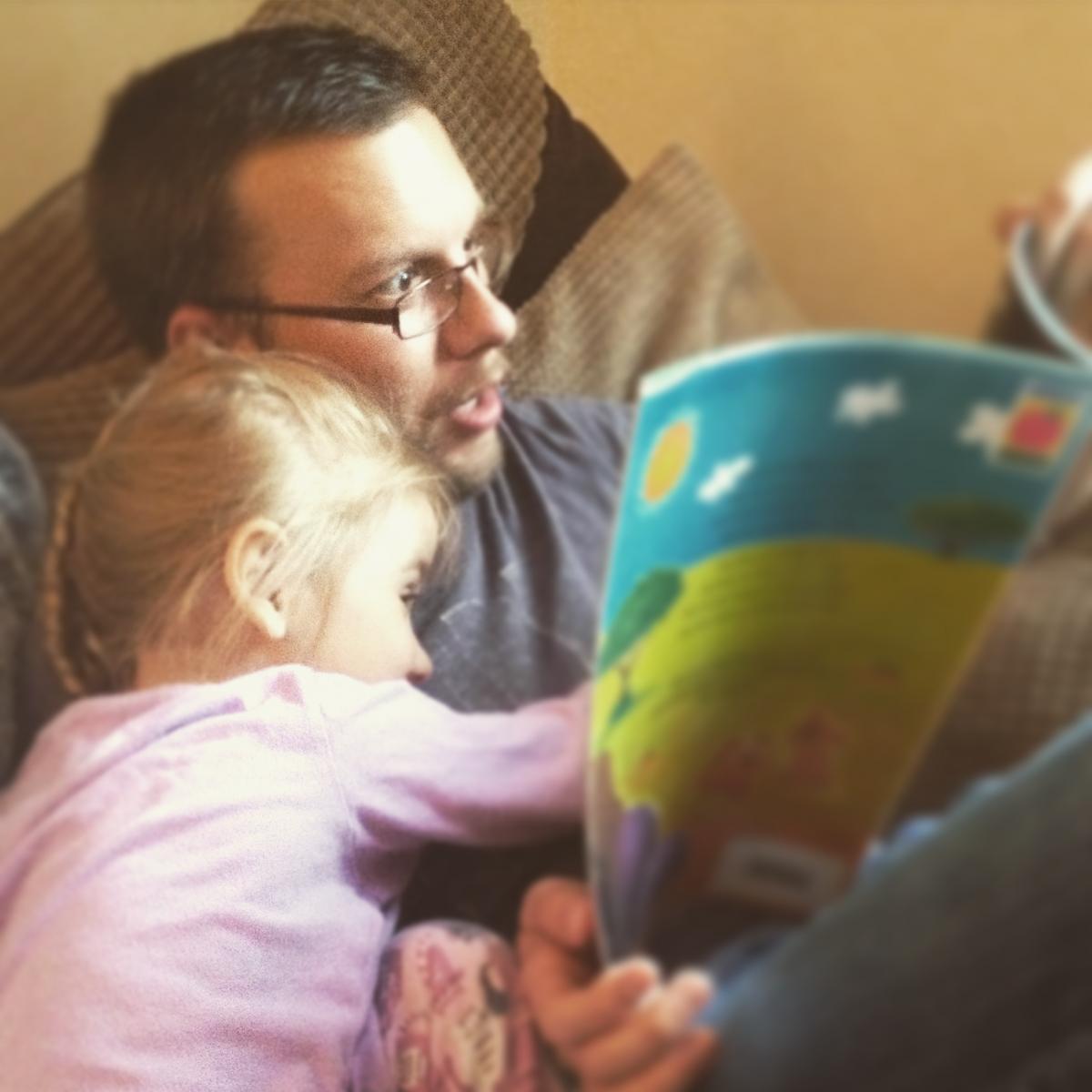 Mark Broscombe reading to Bonnie, aged 3. Their favourite book is Find Anthony Ant by Lorna Philpot