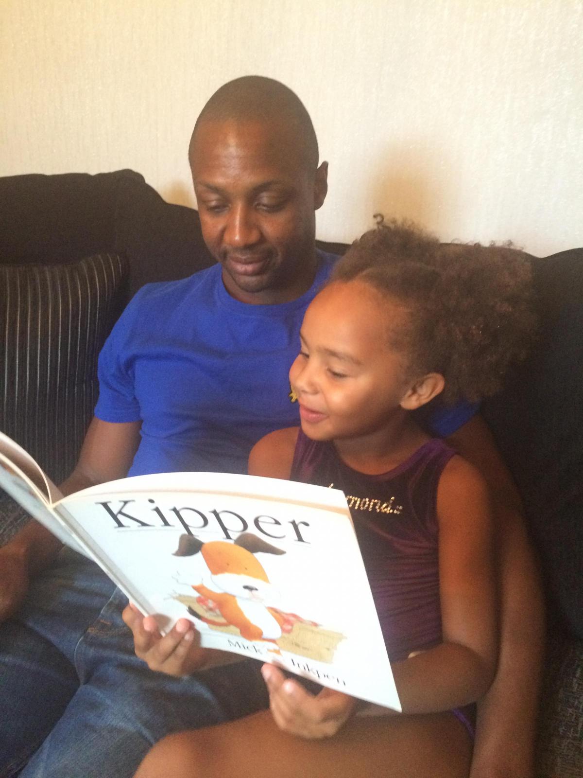 Paul Bulgin reading to his daughter, Milana, aged 6. Their favourite book is Kipper by Mick Inkpen