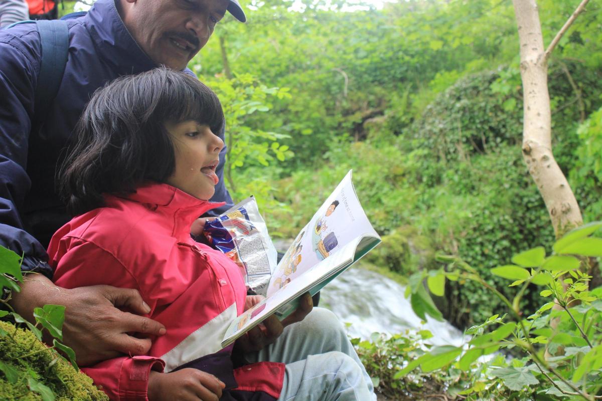 Waqas Raja reading to his daughter Zara, aged 5. Their favourite book to read is Out And About – all about being safe in the outdoors.