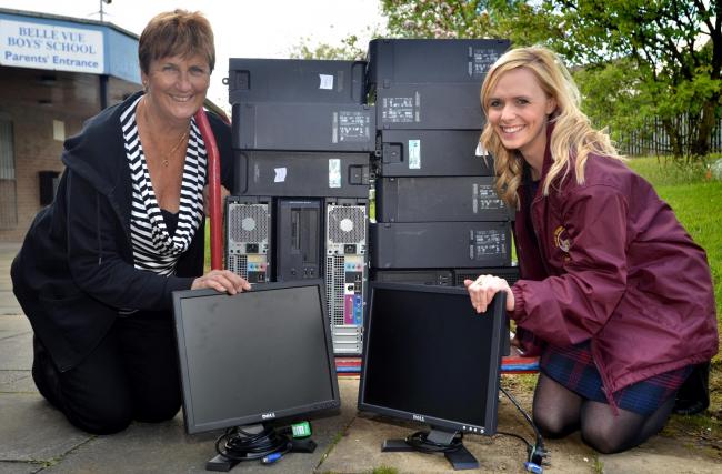 DONATION: Hilary Lawther, trustee of the Gambian Schools Trust, with Lucy Balmforth and a trolley-load of old computers