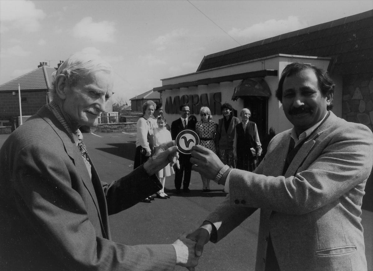 Mohammed Sabir owner of the Aagrah receiving the vegetarian trademark in 1987