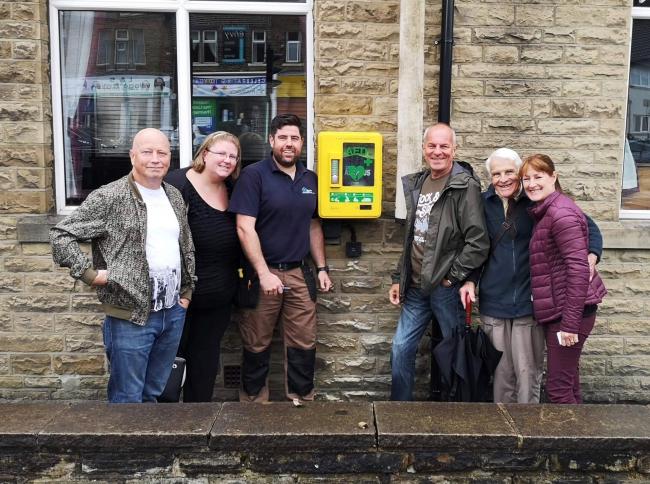 Crossflatts Village Society members with the defibrillator