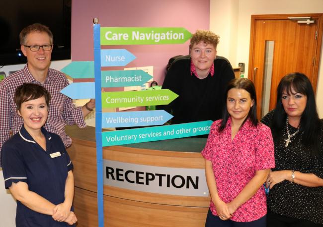 Dr Nick Hayward at his practice with, from left, practice nurse Anna Hill and reception team members Lucy Quearney, Rosy Webster and Mandy Freeman