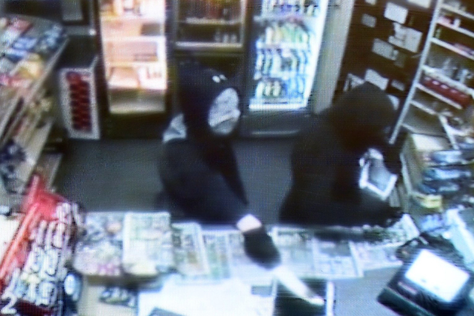 CCTV shows terrifying moment robber with 12-inch knife bursts into Bradford shop