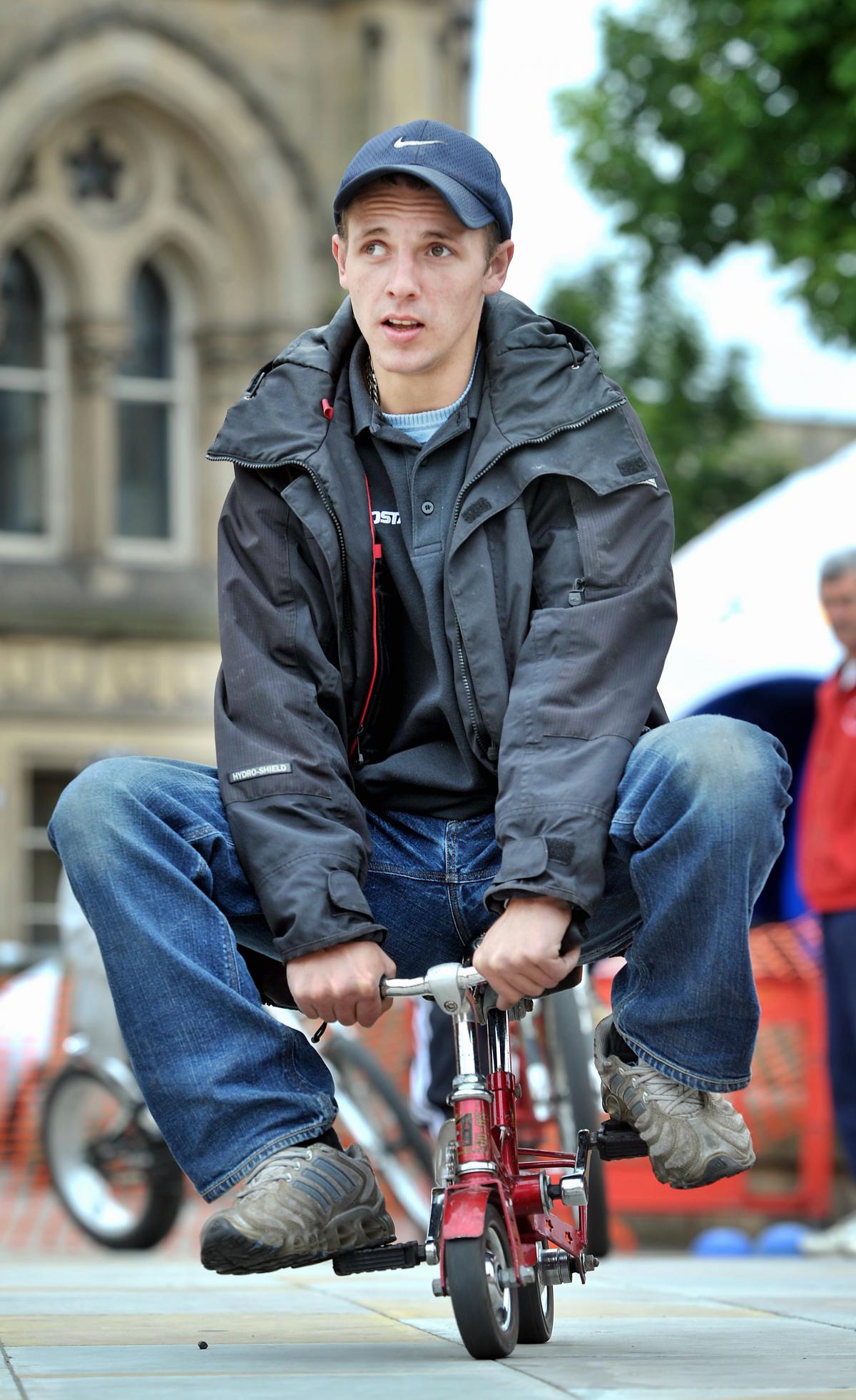 Darren Walker on a miniature bike at the Big City Play Day in Centenary Square, Bradford