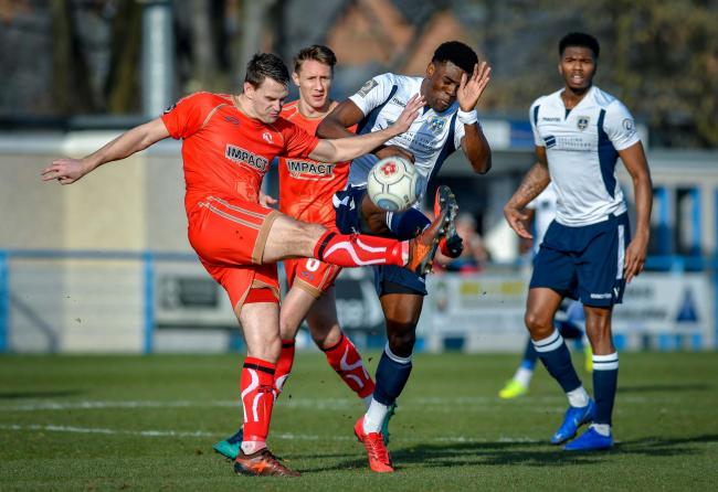 Guiseley striker Kayode Odejayi, right, battles for the ball in his side's 1-0 defeat to Alfreton Town in the Vanarama National League North on Saturday. Picture: Andy Garbutt 