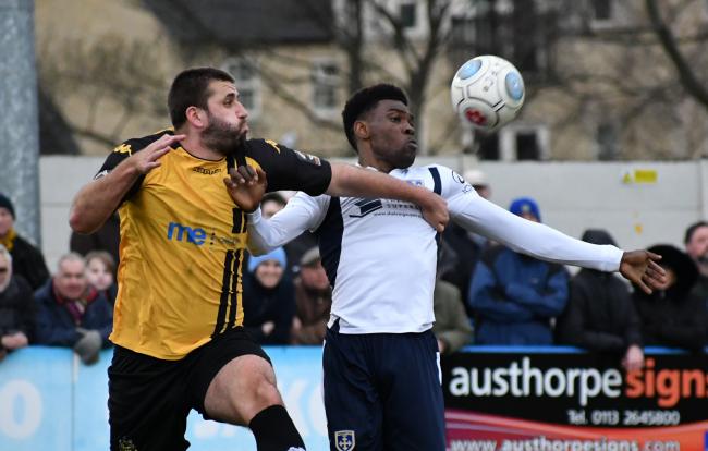 Guiseley's Kayode Odejayi, right, battles for the ball with Southport's Ryan Astles in the Lions' last Vanarama National League North clash earlier this month. Picture: Richard Leach