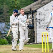 Joel Fothergill (helmetless) took five wickets for Oxenhope on Saturday. Picture: John Ashton.